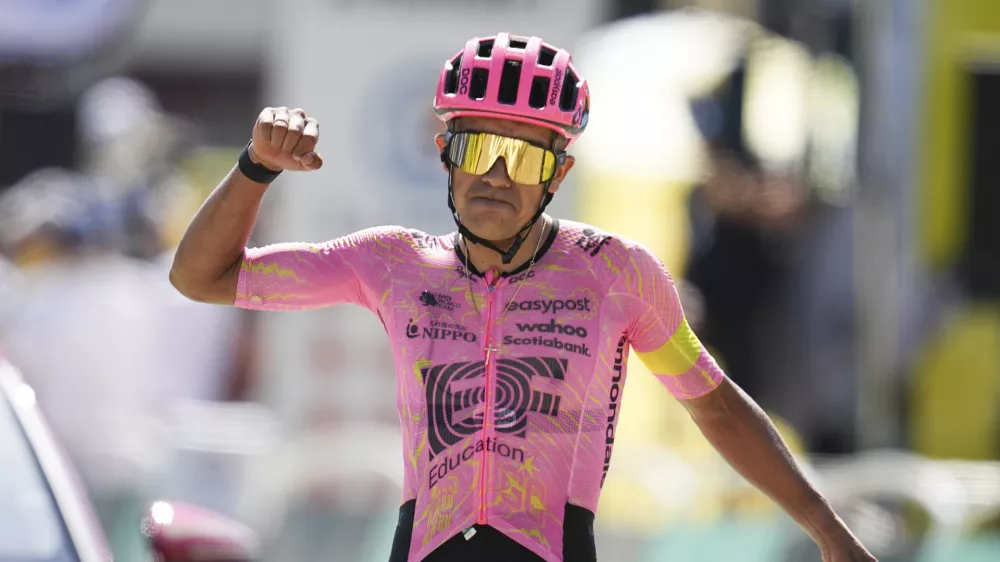 Ecuador's Richard Carapaz celebrates as he crosses the finish line to win the seventeenth stage of the Tour de France cycling race over 177.8 kilometers (110.5 miles) with start in Saint-Paul-Trois-Chateaux and finish in Superdevoluy, France, Wednesday, July 17, 2024. (AP Photo/Daniel Cole)
