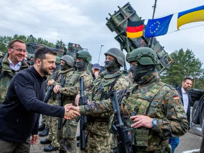 Ukrainian President Volodymyr Zelenskiy interacts with soldiers during his visit to a military training area to find out about the training of Ukrainian soldiers on the ?Patriot? anti-aircraft missile system, at an undisclosed location, in Germany, June 11, 2024.  Jens Buttner/Pool via REUTERS/File Photo
