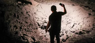 21 August 2025, Russia, Donetsk: A view of a crater on private property after a drone attack by the Armed Forces of Ukraine on Kirovsky neighbourhood. Photo: Dmitry Yagodkin/TASS via ZUMA Press/dpa