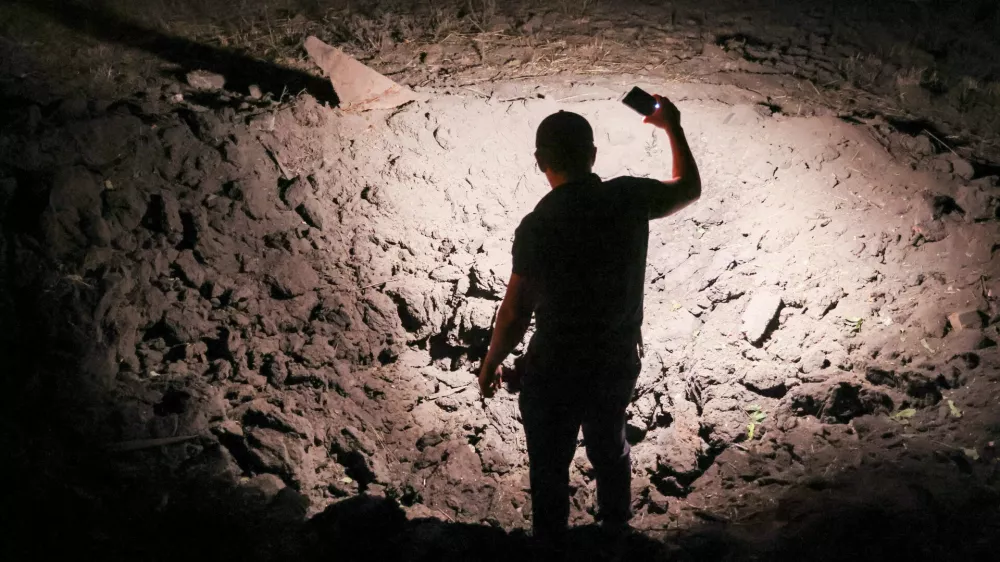 21 August 2025, Russia, Donetsk: A view of a crater on private property after a drone attack by the Armed Forces of Ukraine on Kirovsky neighbourhood. Photo: Dmitry Yagodkin/TASS via ZUMA Press/dpa
