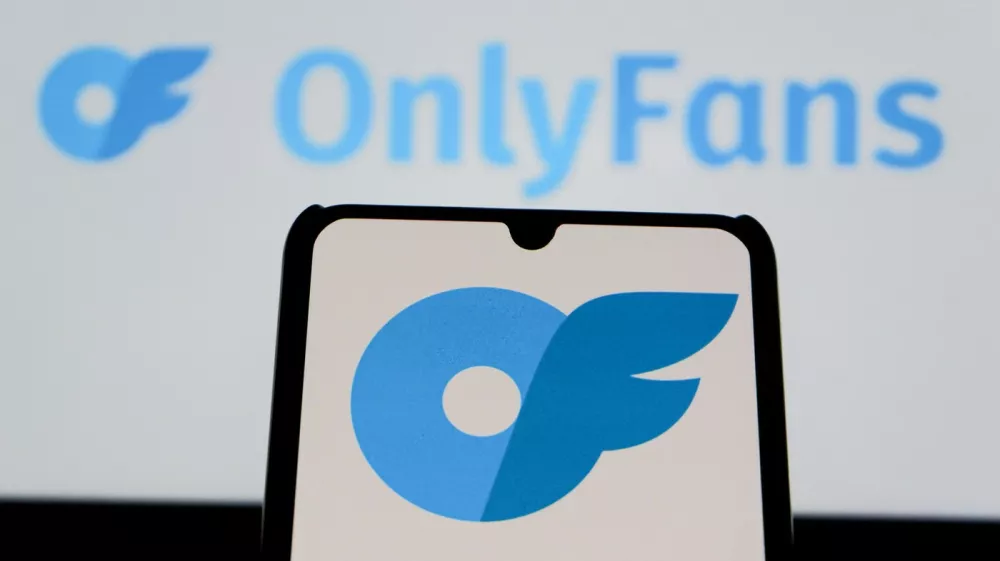 August 12, 2025, Indonesia: In this photo illustration, the OnlyFans logo is seen displayed on a mobile phone and in the background.,Image: 1028930566, License: Rights-managed, Restrictions:, Model Release: no