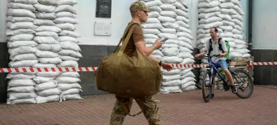 A Ukrainian serviceman walks, amid Russia's attack on Ukraine, in Kyiv, Ukraine, August 21, 2025. REUTERS/Alina Smutko