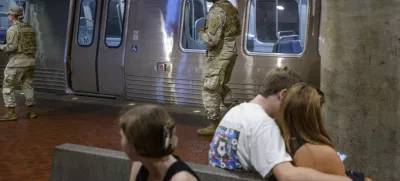 Members of the South Carolina National Guard patrol the platform of the Washington Metro Gallery Place station in Washington, Sunday, Aug. 24, 2025. (AP Photo/Rod Lamkey, Jr.)