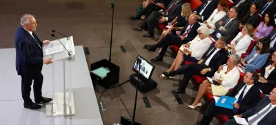 French Prime Minister Francois Bayrou delivers a speech as members of the French government listen to during a press conference about his 2026 budget in Paris, France, August 25, 2025. REUTERS/Abdul Saboor