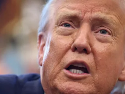 FILE PHOTO: U.S. President Donald Trump delivers remarks in the Oval Office at the White House in Washington, D.C., U.S., August 14, 2025. REUTERS/Kevin Lamarque/File Photo