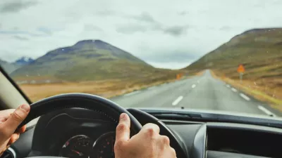 PYTTDD travel, driving car on a beautiful scenic road in Iceland
