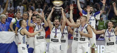﻿Slovenia's Goran Dragic, center, lifts the trophy after defeating Serbia in the Eurobasket European Basketball Championship final match in Istanbul, Sunday, Sept. 17. 2017. (AP Photo/Thanassis Stavrakis)