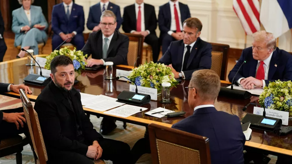 Ukrainian President Volodymyr Zelenskiy speaks during a meeting with U.S. President Donald Trump, French President Emmanuel Macron, British Prime Minister Keir Starmer, and Finland's President Alexander Stubb amid negotiations to end the Russian war in Ukraine, at the White House in Washington, D.C., U.S., August 18, 2025. REUTERS/Al Drago