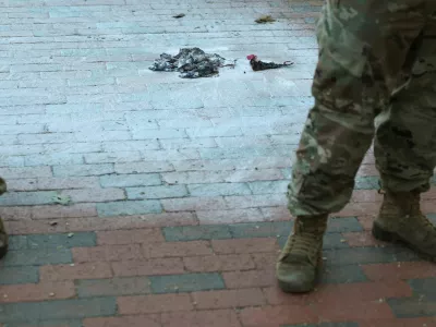U.S. Army National Guard soldiers stand at the scene where a man burned a U.S. flag at the edge of Lafayette Park across from the White House in Washington, D.C., U.S., August 25, 2025. REUTERS/Jonathan Ernst
