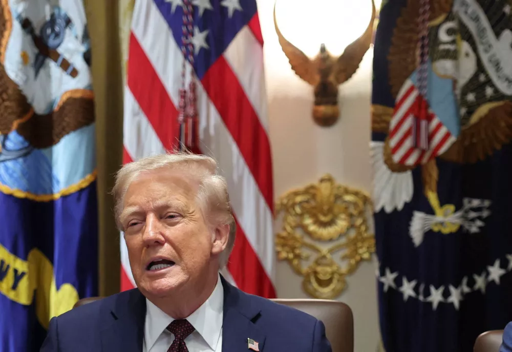 U.S. President Donald Trump reacts during a cabinet meeting at the White House in Washington, D.C., U.S., August 26, 2025. REUTERS/Jonathan Ernst