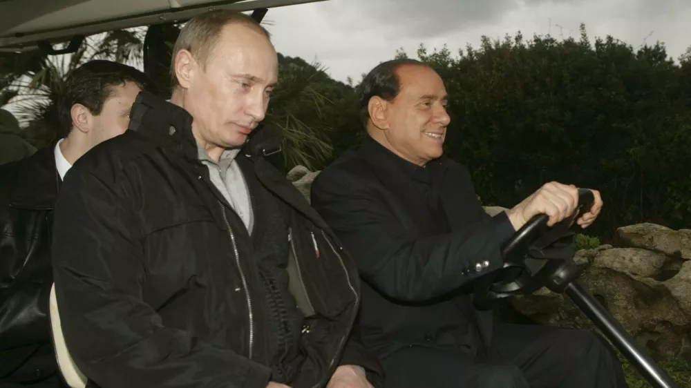 Russia's President Vladimir Putin (L) rides on a golf cart with Italy's Prime Minister-elect Silvio Berlusconi at Berlusconi's Sardinian private summer residence villa "La Certosa" in Porto Rotondo village April 17, 2008. Putin arrived for an overnight private visit on his return from Libya. Picture taken April 17, 2008. REUTERS/Livio Anticoli-People of Freedom party/ Handout (ITALY). FOR EDITORIAL USE ONLY. NOT FOR SALE FOR MARKETING OR ADVERTISING CAMPAIGNS.