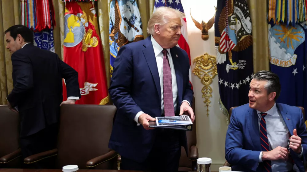 U.S. President Donald Trump leaves, following a cabinet meeting, next to Secretary of State Marco Rubio and Defense Secretary Pete Hegseth, at the White House in Washington, D.C., U.S., August 26, 2025. REUTERS/Jonathan Ernst