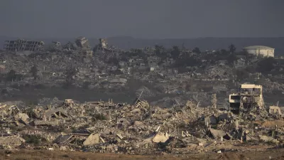 Buildings that were destroyed during the Israeli ground and air operations stand in the Gaza Strip as seen from southern Israel, Thursday, Aug. 28, 2025. (AP Photo/Maya Levin)