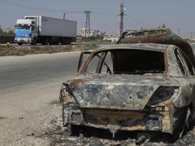 A truck carrying U.N. humanitarian aid heads toward Sweida city, southern Syria, Thursday, Aug. 28, 2025. (AP Photo/Omar Sanadiki)