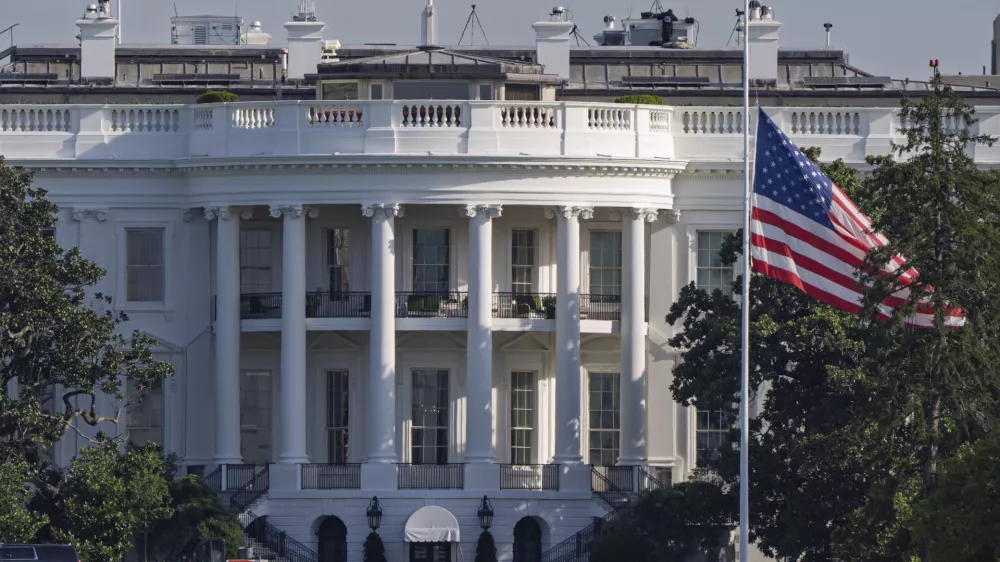 The American flag flies at half-staff at the White House in Washington, Thursday, Aug. 28, 2025, following the shooting at a Catholic church in Minneapolis. (AP Photo/J. Scott Applewhite)