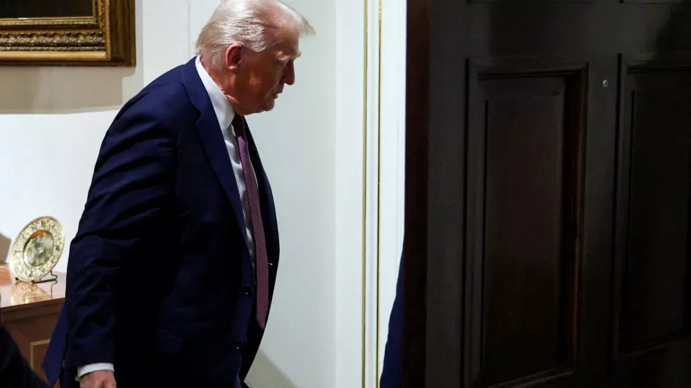 FILE PHOTO: U.S. President Donald Trump leaves, following a cabinet meeting, at the White House in Washington, D.C., U.S., August 26, 2025. REUTERS/Jonathan Ernst/File Photo