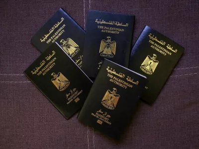 Palestinian passports belonging to members of the Banat Gaza, which means "Girls of Gaza", a group of young women rebuilding their lives through cultural preservation with crafting handmade bags and selling traditional clothing that reflect their heritage, after fleeing the war in Khan Younis, Gaza, following the events of October 7, 2023, are displayed in Obour City, Egypt July 15, 2025. REUTERS/Hadeer Mahmoud