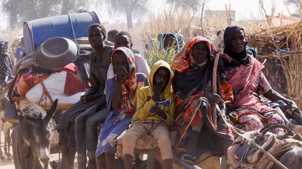 FILE PHOTO: Displaced people ride a an animal-drawn cart, following Rapid Support Forces (RSF) attacks on Zamzam displacement camp, in the town of Tawila, North Darfur, Sudan April 15, 2025. REUTERS/Stringer/File Photo