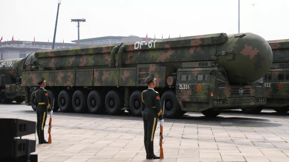 Members of the People's Liberation Army stand as the strategic strike group displays DF-61 nuclear missiles during a military parade to mark the 80th anniversary of the end of World War Two, in Beijing, China, September 3, 2025. REUTERS/Tingshu Wang