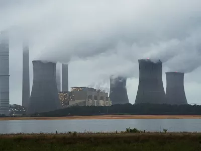 ﻿FILE - This June 1, 2014, file photo show the coal-fired Plant Scherer in operation in Juliette, Ga. Despite what President Donald Trump says, scientists have long known that what's warming the planet isn't natural. It's us. Climate scientists say Trump was wrong. There are several ways they know that more than 90 percent of climate change is caused by emissions of heat-trapping gases from activities like burning coal and natural gas for electricity, or burning gasoline, diesel and jet fuel for transportation. In other words, humans. (AP Photo/John Amis, File)