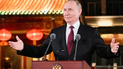 Russian President Vladimir Putin gestures during a press conference, at the end of his visit to China for the Tianjin SCO Summit and the military parade to mark the 80th anniversary of the end of World War Two, in Beijing, China, Wednesday, Sept. 3, 2025. (Sergei Bobylev, Sputnik, Kremlin Pool Photo via AP)