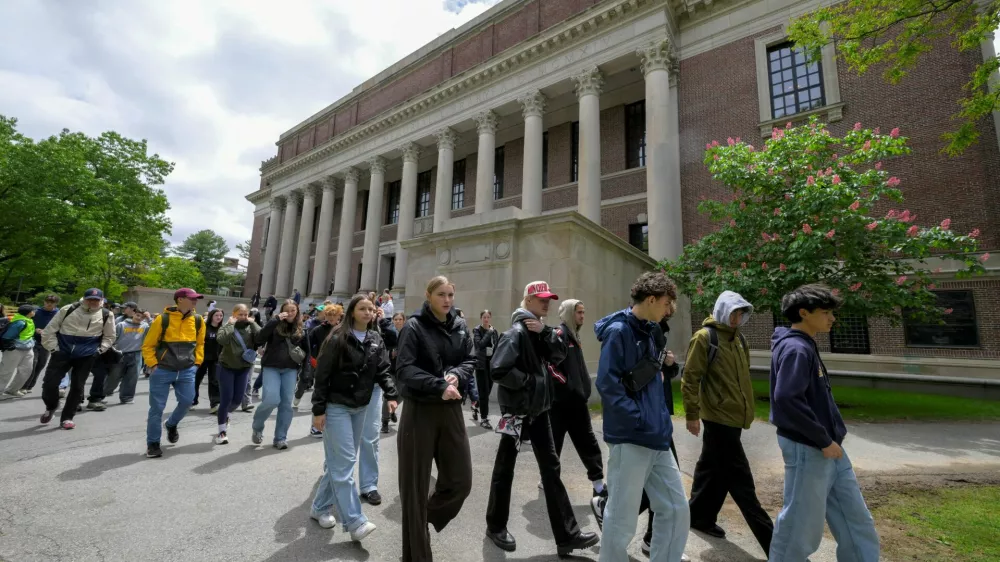 FILE PHOTO: Students from Quebec, Canada tour the campus of Harvard University in Cambridge, Massachusetts, U.S., May 23, 2025.  REUTERS/Faith Ninivaggi/File Photo