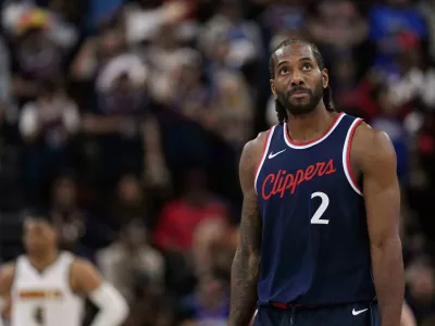 FILE - Los Angeles Clippers forward Kawhi Leonard, right, looks toward the scoreboard during the second half of an NBA basketball game, May 1, 2025, in Inglewood, Calif. (AP Photo/Mark J. Terrill, file)