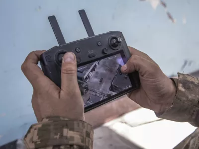 A Ukrainian soldier looks at a drone screen showing Russian troops positions during heavy fighting at the front line in Severodonetsk, Luhansk region, Ukraine, Wednesday, June 8, 2022. (AP Photo/Oleksandr Ratushniak)