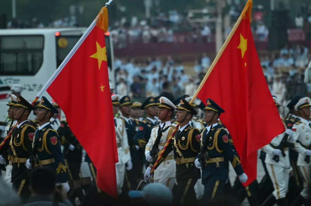 03 September 2025, China, Beijing: Soldiers of the People's Liberation Army walk past Tiananmen Square during a rehearsal for the upcoming military parade in Beijing. Photo: Johannes Neudecker/dpa