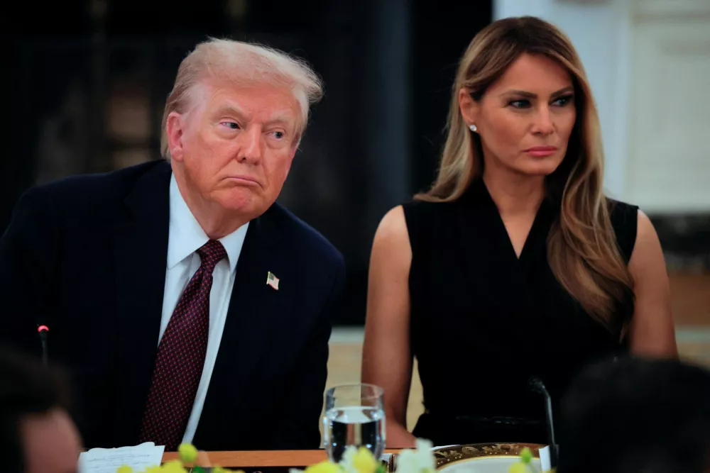 U.S. President Donald Trump and first lady Melania Trump attend a private dinner for technology and business leaders in the State Dining Room at the White House in Washington, D.C., U.S., September 4, 2025. REUTERS/Brian Snyder