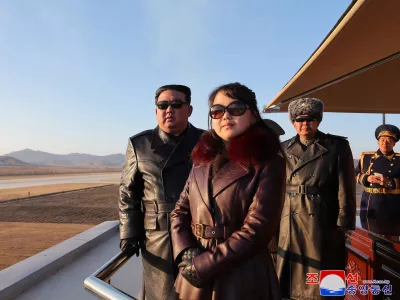 This picture taken on November 30, 2023 and released from North Korea's official Korean Central News Agency (KCNA) via KNS on December 1, 2023 shows North Korea's leader Kim Jong Un (L) and his daughter (C), presumed to be named Ju Ae, observing an air festival during a visit with the 1st Air Force Division Flying Regiment of the Korean People's Army to commemorate Air Day, at an unknown location.,Image: 825710791, License: Rights-managed, Restrictions: South Korea OUT / REPUBLIC OF KOREA OUT---EDITORS NOTE--- RESTRICTED TO EDITORIAL USE - MANDATORY CREDIT "AFP PHOTO/KCNA VIA KNS" - NO MARKETING NO ADVERTISING CAMPAIGNS - DISTRIBUTED AS A SERVICE TO CLIENTS / THIS PICTURE WAS MADE AVAILABLE BY A THIRD PARTY. AFP CAN NOT INDEPENDENTLY VERIFY THE AUTHENTICITY, LOCATION, DATE AND CONTENT OF THIS IMAGE ---, ***HANDOUT image or SOCIAL MEDIA IMAGE or FILMSTILL for EDITORIAL USE ONLY! * Please note: Fees charged by Profimedia are for the Profimedia's services only, and do not, nor are they intended to, convey to the user any ownership of Copyright or License in the material. Profimedia does not claim any ownership including but not limited to Copyright or License in the attached material. By publishing this material you (the user) expressly agree to indemnify and to hold Profimedia and its directors, shareholders and employees harmless from any loss, claims, damages, demands, expenses (including legal fees), or any causes of action or allegation against Profimedia arising out of or connected in any way with publication of the material. Profimedia does not claim any copyright or license in the attached materials. Any downloading fees charged by Profimedia are for Profimedia's services only. * Handling Fee Only ***, Model Release: no