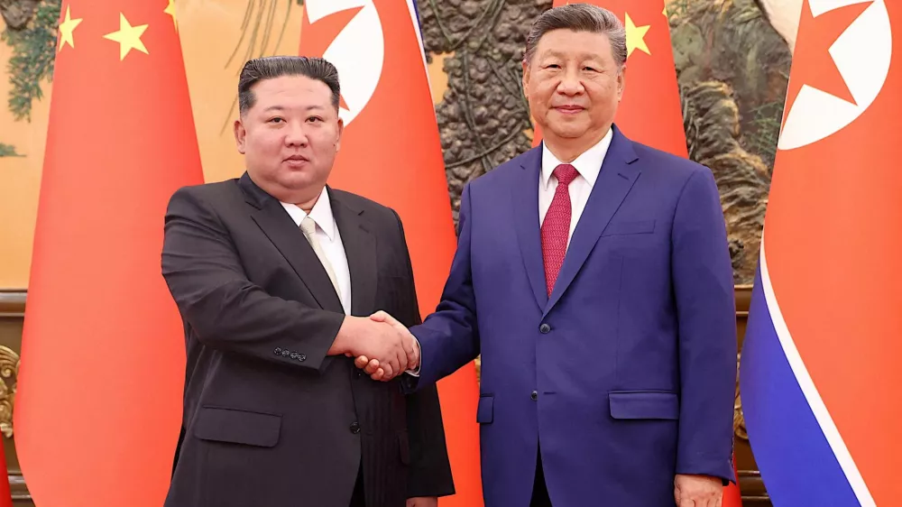 Chinese President Xi Jinping and Democratic People's Republic of Korea (DPRK) leader Kim Jong Un shake hands at the Great Hall of the People in Beijing, China September 4, 2025. China Daily via REUTERS ATTENTION EDITORS - THIS IMAGE WAS PROVIDED BY A THIRD PARTY. CHINA OUT.