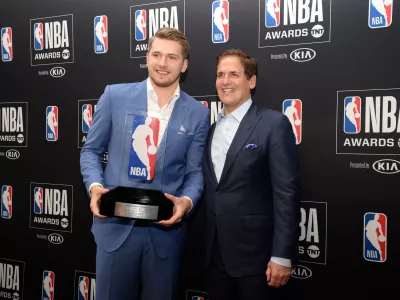 ﻿June 24, 2019; Los Angeles, CA, USA; Dallas Mavericks guard Luka Doncic poses with owner Mark Cuban following his award for Rookie Of The Year at the 2019 NBA Awards show at Barker Hanger. Mandatory Credit: Gary A. Vasquez-USA TODAY Sports - 12952404
