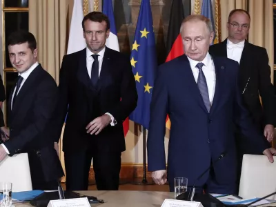 ﻿Russian President Vladimir Putin, right, Ukrainian President Volodymyr Zelenskiy, left, and French President Emmanuel Macron, center, arrive at a working session at the Elysee Palace Monday, Dec. 9, 2019 in Paris. Russian President Vladimir Putin and Ukraine's president are meeting for the first time at a summit in Paris to find a way to end the five years of fighting in eastern Ukraine. (Ian Langsdon/Pool via AP)