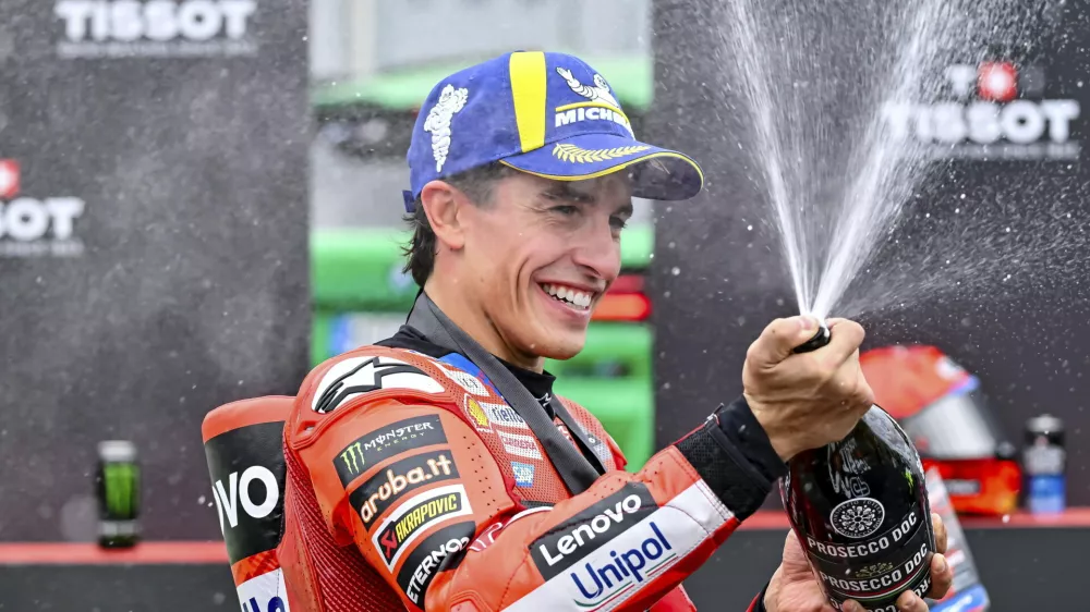 Winning Ducati Lenovo rider Marc Marquez of Spain, celebrates on the podium after the sprint of the MotoGP Hungarian Grand Prix at the Balaton Park Circuit in Balatonfokajar, Hungary, Saturday, Aug. 23, 2025. (Tamas Vasvari/MTI via AP)