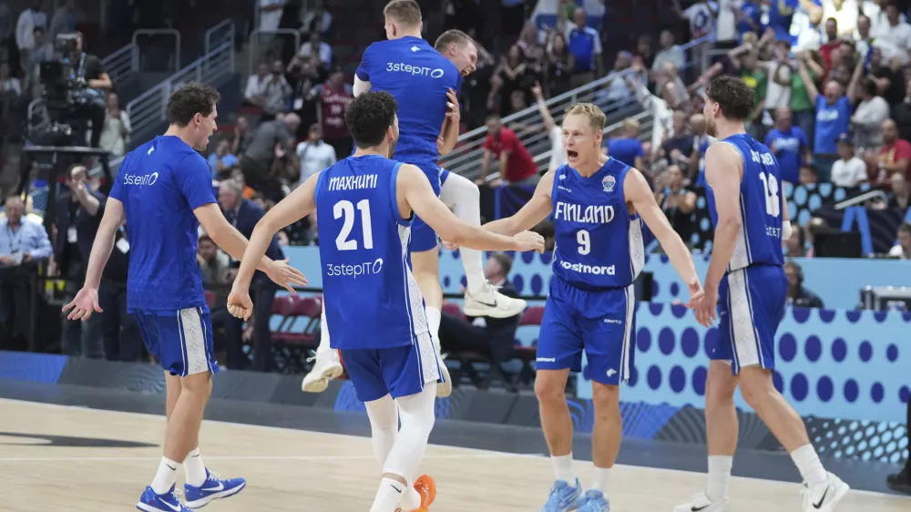 Finland players celebrate their victory after the Eurobasket, European Basketball Championship round of 16 match between Serbia and Finland at the Riga Arena in Riga, Latvia, Saturday, Sept. 6, 2025. (AP Photo/Sergei Grits)