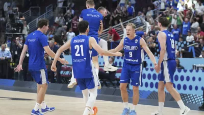 Finland players celebrate their victory after the Eurobasket, European Basketball Championship round of 16 match between Serbia and Finland at the Riga Arena in Riga, Latvia, Saturday, Sept. 6, 2025. (AP Photo/Sergei Grits)