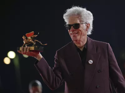 Director Jim Jarmusch, winner of the Golden Lion for best film for 'Father Mother Sister Brother', poses for photographers at the awards photo call during the 82nd edition of the Venice Film Festival in Venice, Italy, on Saturday, Sept. 6, 2025. (Photo by Alessandra Tarantino/Invision/AP)