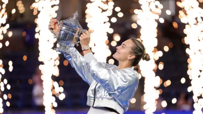 Sep 6, 2025; Flushing, NY, USA; Aryna Sabalenka celebrates with the championship trophy after defeating Amanda Anisimova (USA) (not pictured) the women's singles final of the 2025 US Open tennis championships at Billie Jean King National Tennis Center. Mandatory Credit: Robert Deutsch-Imagn Images