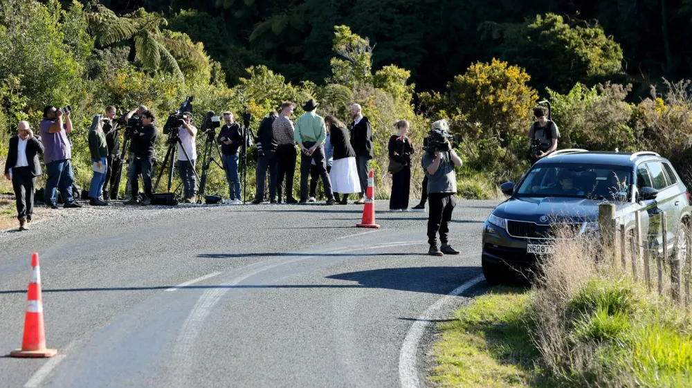 Members of the media stand on the side of a road where a police shootout occurred near the town of Piopio, located in New Zealand's Waikato region on September 8, 2025. A New Zealand father who spent nearly four years on the run with his children was killed in a police shootout on September 8, authorities said. Tom Phillips, who absconded with his three children in December 2021 after a row with his former partner, died in the rolling hill country of the North Island's Waikato region.,Image: 1035208608, License: Rights-managed, Restrictions:, Model Release: no
