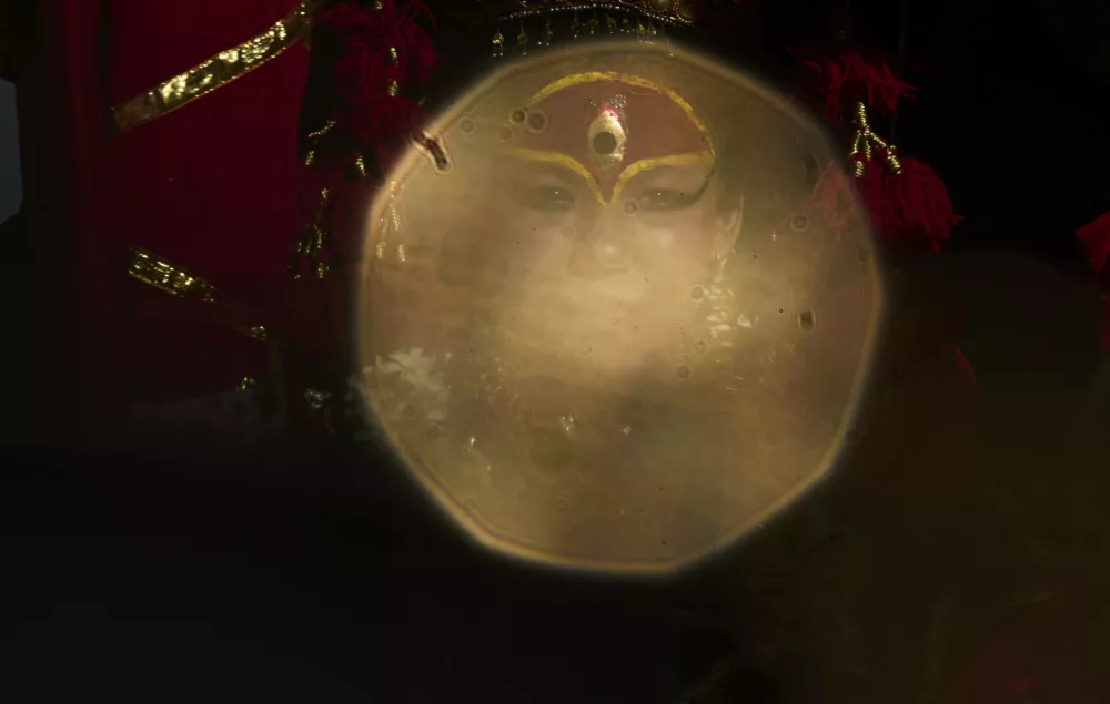 Living goddess Kumari is seen sitting inside the chariot during Indra Jatra, a festival that marks the end of the rainy season in Kathmandu, Nepal, Saturday, Sept. 6, 2025. (AP Photo/Niranjan Shrestha)