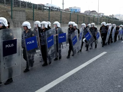 Riot police walk outside the Istanbul provincial office of the main opposition Republican People's Party (CHP), as CHP supporters gather near the office, after a recent court ruling that ousted the CHP's Istanbul provincial leadership, in Istanbul, Turkey, September 8, 2025. REUTERS/Dilara Acikgoz