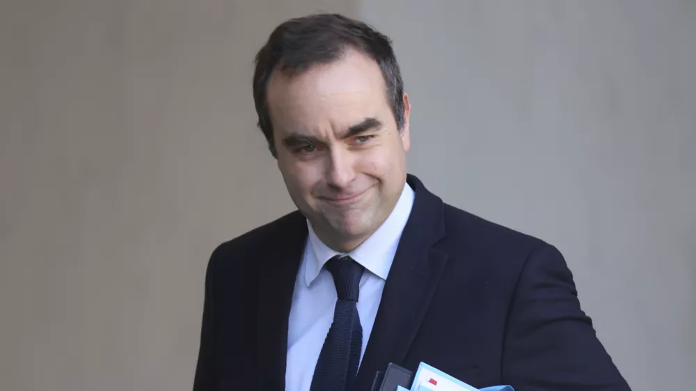 FILE - French Defense Minister Sebastien Lecornu leaves the first cabinet meeting of the new government, at the Elysee Palace in Paris, Friday, Jan. 3, 2025. (AP Photo/Thomas Padilla, File)
