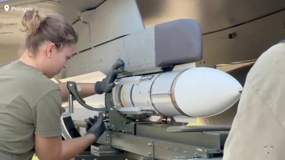 A member of personnel works after the French armed forces mobilised three Rafale fighter jets following the launch of the Eastern Sentry operation to bolster the defence of NATO's eastern flank in response to Russian drone incursions into Polish airspace, in a location given as Poland in this screen grab from a handout video released on September 12, 2025. French Armed Forces/Handout via REUTERS THIS IMAGE HAS BEEN SUPPLIED BY A THIRD PARTY. NO RESALES. NO ARCHIVES. MANDATORY CREDIT