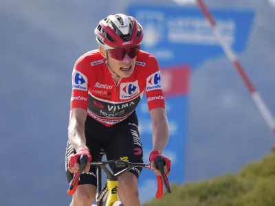 Danish cyclist Jonas Vingegaard completes the final meters before winning the 20th stage and his first overall victory in the Spanish cycling race La Vuelta, from Robledo de Chavela to Bola del Mundo, in Puerto de Navacerrada, Spain, on Saturday, September 13, 2025. (AP Photo/Manu Fernández)