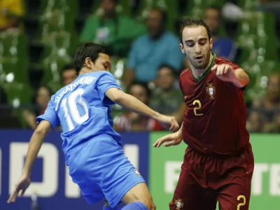 Portugal's Ricardinho, right, fights for the ball with Thailand's Eakapong Suratsawang during their FIFA Futsal World Cup 2008 match in Brasilia, Wednesday, Oct. 8, 2008. (AP Photo/Eraldo Peres)