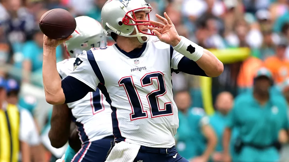 ﻿Dec 9, 2018; Miami Gardens, FL, USA; New England Patriots quarterback Tom Brady (12) throws a pass against the Miami Dolphins during the first half at Hard Rock Stadium. Mandatory Credit: Steve Mitchell-USA TODAY Sports