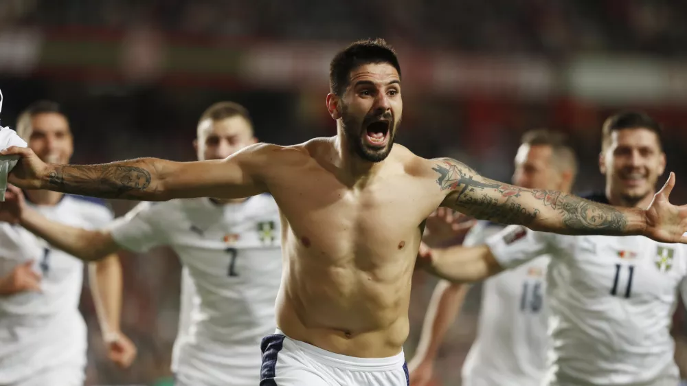﻿Soccer Football - World Cup - UEFA Qualifiers - Group A - Portugal v Serbia - Estadio da Luz, Lisbon, Portugal - November 14, 2021 Serbia's Aleksandar Mitrovic celebrates scoring their second goal REUTERS/Pedro Nunes