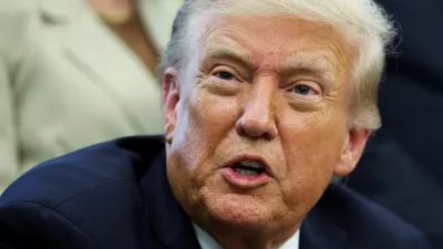 U.S. President Donald Trump reacts after signing a memorandum to send federal resources to Memphis, Tennessee, for a surge against local crime, in the Oval Office at the White House in Washington, D.C., U.S., September 15, 2025. REUTERS/Jonathan Ernst