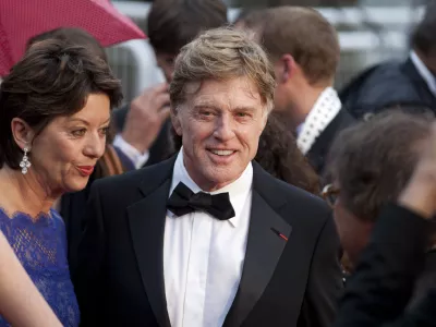 ﻿Actor Robert Redford, centre, and his wife Sibylle Szaggars, centre left, arrive for the screening of All Is Lost at the 66th international film festival, in Cannes, southern France, Wednesday, May 22, 2013. (AP Photo/Virginia Mayo)
